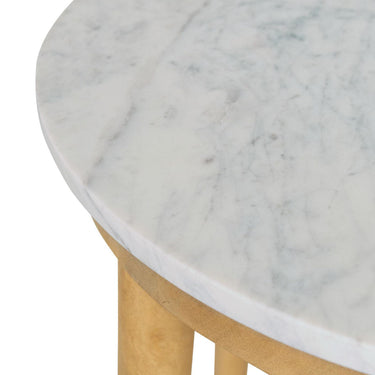 Close-up view of the unique grey veining patterns on the round honed marble surface