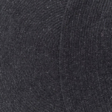 Close-up of black Carousel Round Outdoor Rug in Creme