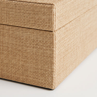 Raffia storage box in natural tone.