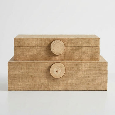 Two stacked rectangular storage boxes with woven natural-fiber texture and round wooden knobs.