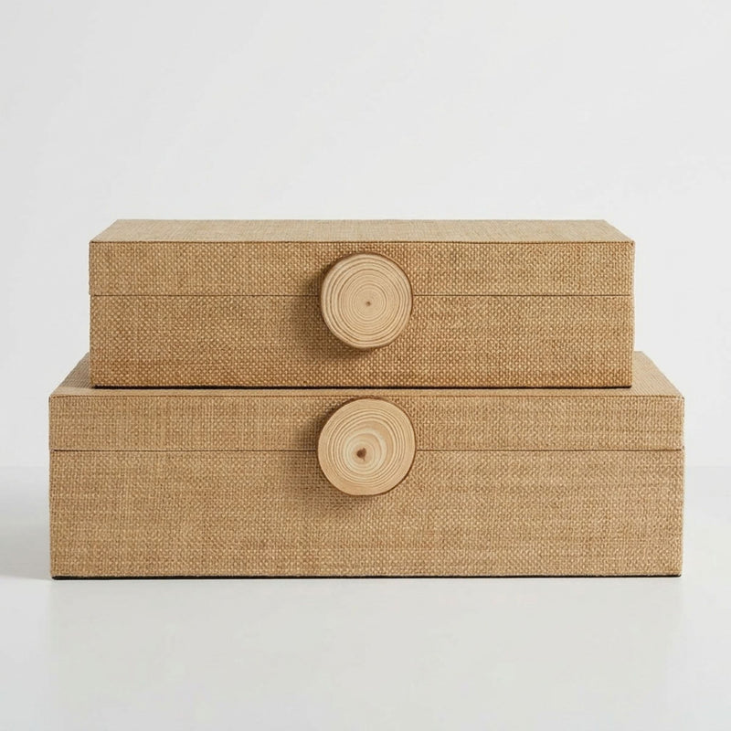 Two stacked rectangular storage boxes with woven natural-fiber texture and round wooden knobs.