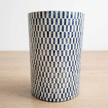 Santorini Drum side table with a blue and white checkered pattern.