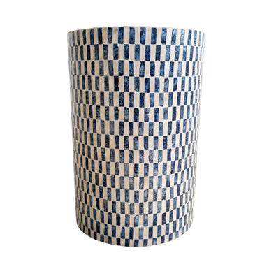 A cylindrical side table  blue and white checkered pattern made from inlaid capiz rectangular pieces, shown against a plain white background.