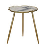 Modern scalloped side table with a white and gray marble  effect top and a gold-finished metal frame and tripod legs.