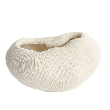 white coral bowl features a scalloped edge design.