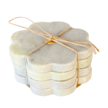 marble coasters with scalloped flower silhouette with a central brass detail