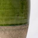 Close-up of the sicily clay vase with a glossy green crackled glaze on the upper portion and a textured natural base on a white background.