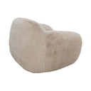Snuggles cream accent chair showing its cozy, rounded form.