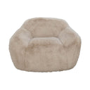 large cream faux fur occasional chair with a plush, oversized silhouette.