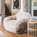 snuggles faux fur chair arranged for conversation in an open-plan lounge.