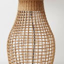 Detailed view of the sol minimalist lamp hand-woven rattan cane craftsmanship and airy open-weave sculptural silhouette