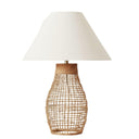 Sol natural rattan table lamp featuring an open-weave base and a crisp beige fabric shade.