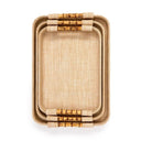 Set of three nesting grasscloth raffia rectangular trays with light beige woven texture and real bamboo handles