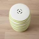 Spiral Ceramic Stool highlighting the lucky coin cutout and smooth top.