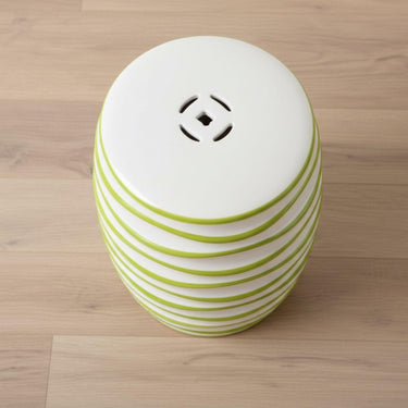 Spiral Ceramic Stool highlighting the lucky coin cutout and smooth top.