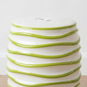 Spiral Ceramic Stool showing the raised lime green spirals and textured finish.