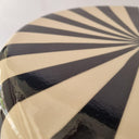 Close-up of the Striped Ceramic Side Table – Black showing the glossy ceramic finish