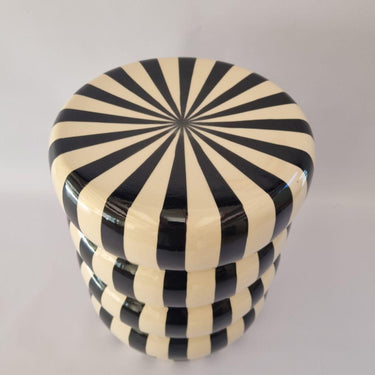 Angled top view of the Striped Ceramic Side Table – Black highlighting the striped pattern