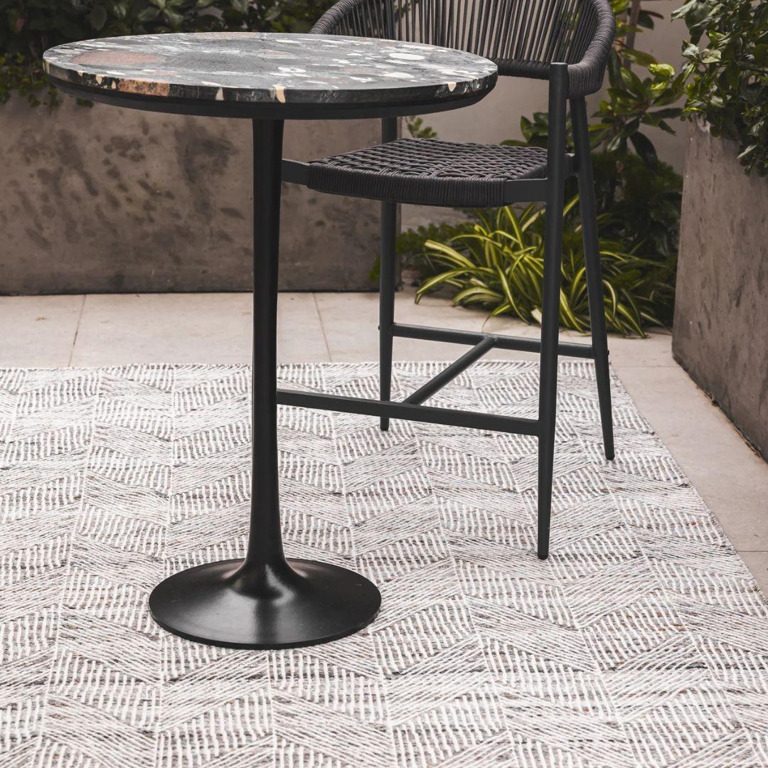 sunstrokes outdoor rug in Gull styled