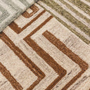 plush wool texture and geometric maze pattern of the tanled rug