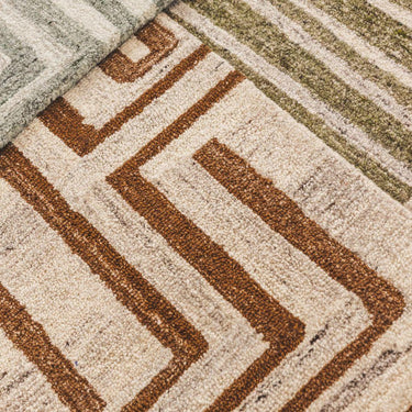 plush wool texture and geometric maze pattern of the tanled rug