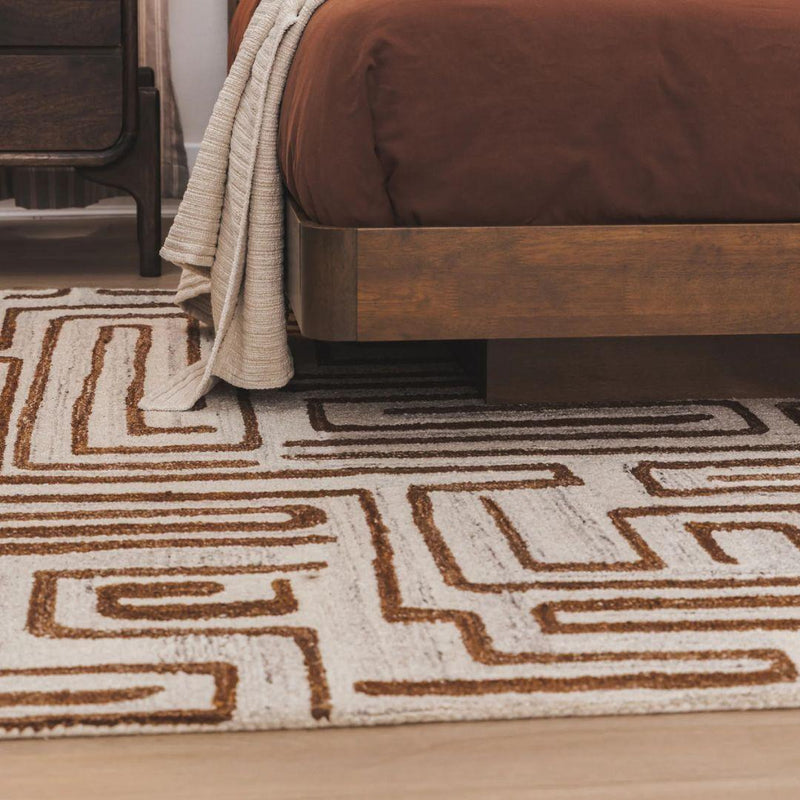 tangled maze pattern wool rug under a bed