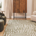 Tangled Rug with green tones featuring plush wool and geometric maze pattern styled in a moder home