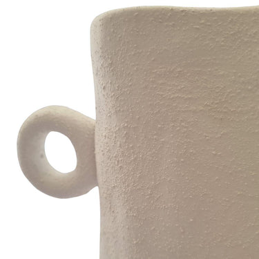 Sculptural white ceramic vase featuring textured surface