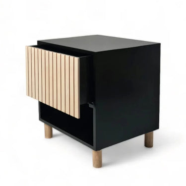 Black nightstand with natural birch fluted drawer and black open shelf. Contemporary storage nightstand with warm detail.