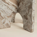 Toronto marble side table top showing warm white and brown veining on arch-panel base
