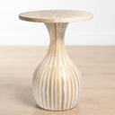 Tulum Side Table with a flared pedestal base, featuring a light natural top and a bulbous base with alternating vertical beige and white stripes, set against a neutral light background.