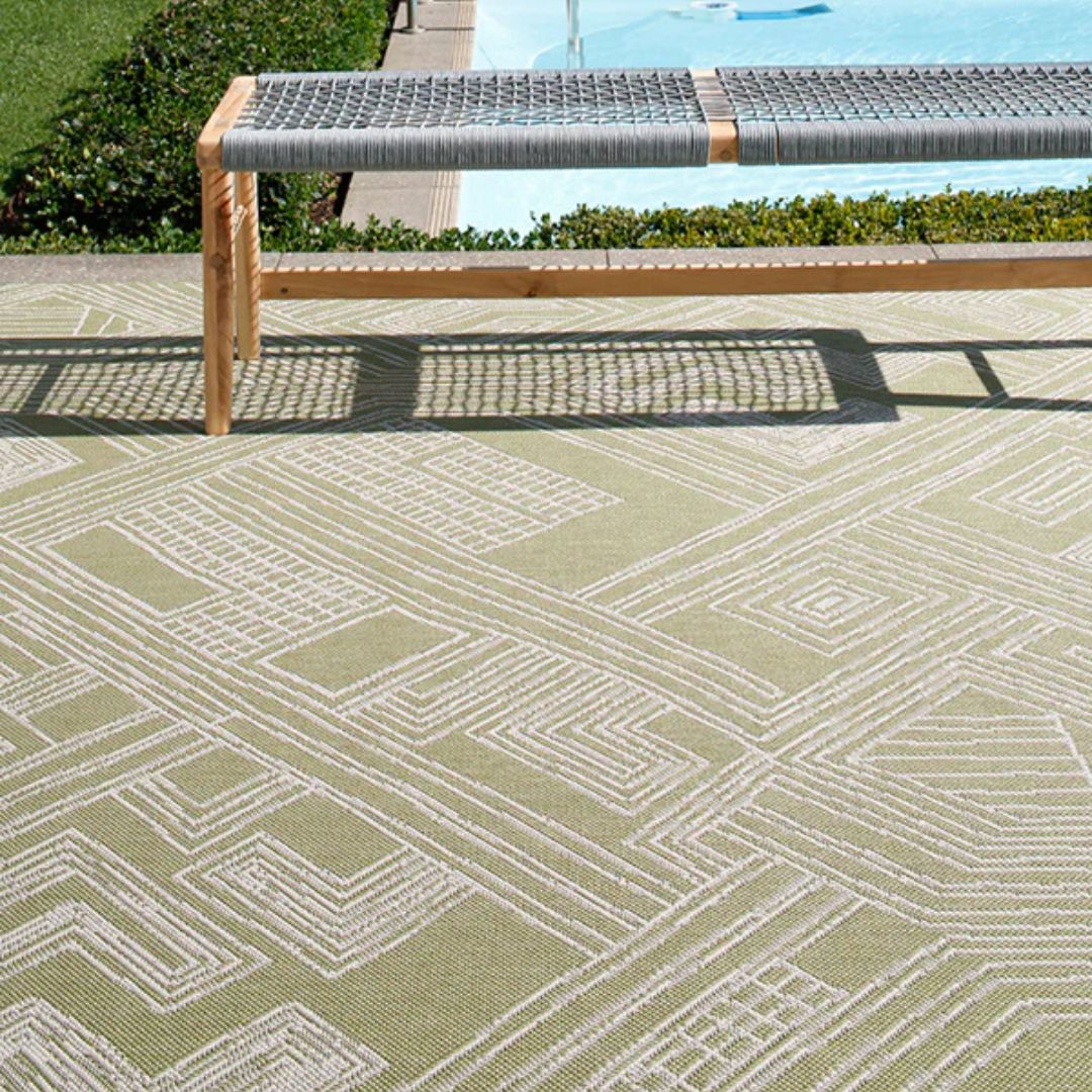 Urban Moss Rug styled poolside with a wooden bench