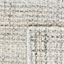 Close-up of handwoven recycled PET polyester texture of Veranda Outdoor Rug in shell