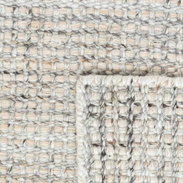 Close-up of handwoven recycled PET polyester texture of Veranda Outdoor Rug in shell