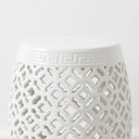 Polished white finish and decorative open-weave design on a sculptural ceramic stool