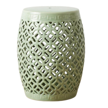 Vilasa sage green ceramic stool featuring an intricate lattice cut-out design and classic barrel silhouette