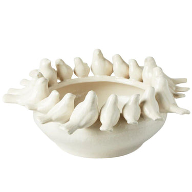 decorative bowl, adorned with ceramic birds perched around the edge, serves as a sculptural accent for everyday styling.
