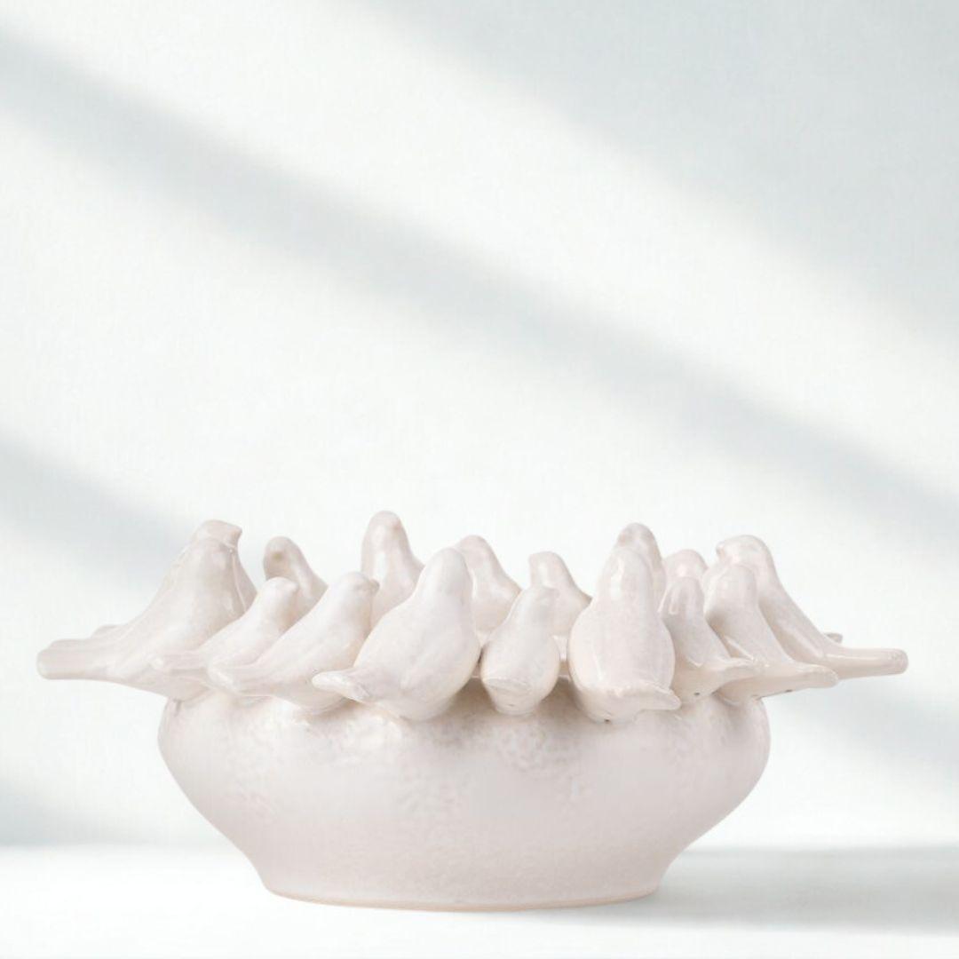 White Ceramic Birds Bowl on plain surface  showing bowl shape and birds
