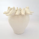 White Ceramic Birds Vase styled simply on a plain backdrop