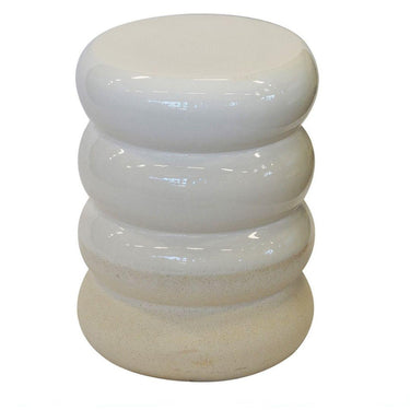 White cylindrical side table with stacked design on a white background