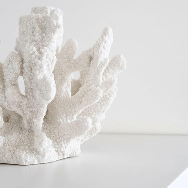 Detailed view of the intricate resin crevices and natural ocean-inspired ridges on a white coral tapered candle holder.