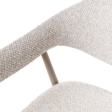 Close-up of oats textured fabric upholstery and curved wraparound armrest design.