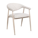 Side view of the Yvette dining chair with curved wraparound armrest, a curved backrest and textured boucle-style fabric upholstery.