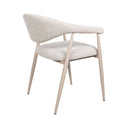 Yvette boucle dining chair in oats showing the cream fabric upholstery and curved wraparound armrest design.

