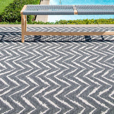Zagzi Grey Rug styled poolside outdoors