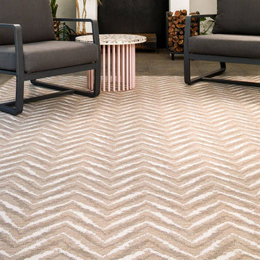 Zagzi Sand Rug styled on an outdoor patio setup with moder furniture